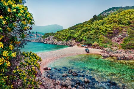 Attractive spring view of Limni Beach Glyko. Fabulous morning seascape of Ionian Sea. Splendid outdoor scene of Corfu island, Greece, Europe. Beauty of nature concept background. の写真素材