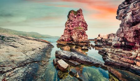 Unbelievable spring sunrise of Kanoni Beach. Colorful morning seascape of Ionian Sea. Great outdoor scene of Kassiopi village and resort, Corfu island, Greece, Europe. Beauty of nature concept background. の写真素材