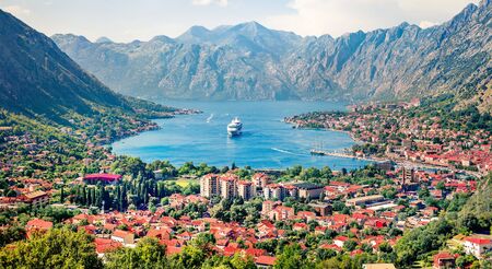 Bright summer cityscape of Kotor port. Aerial morning view of Kotor bay and  limestone cliffs of Mt....