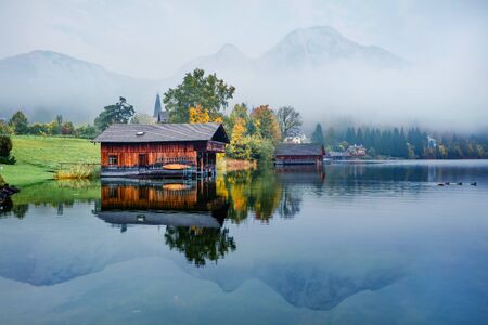 Foggy autumn scene of Altaussee town, district of Liezen in Styria, Austria. Gorgeous morning view...