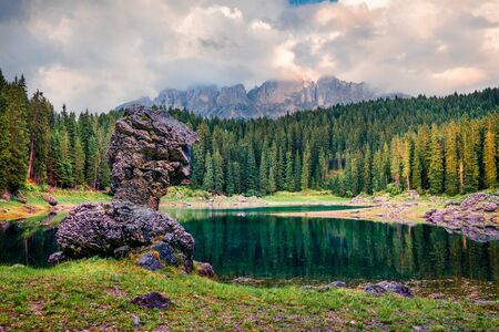 Amazing summer view of Carezza (Karersee) lake. Calm morning scene of Dolomiti Alps, South Tyrol,...