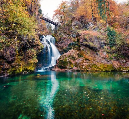 Amazing view of huge waterfall in Vintgar Gorge Canyon. Nice autumn scene of Triglav National Park,...