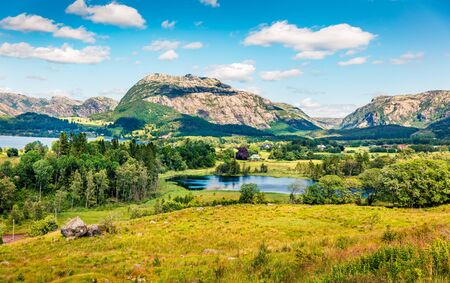 Splendid countryside Norwegian landscape. Colorful summer morning in Norway, Europe. Beauty of nature concept background.の写真素材