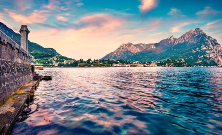 Picturesque summer sunrise on Como lake. Splendid morning cityscape of Lecco town, Italy, Europe. Traveling concept background.の写真素材