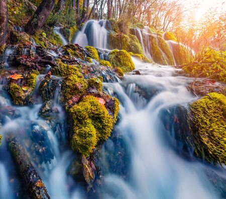 Picturesque morning view of pure water waterfall in Plitvice National Park. Fabulous autumn scene of...