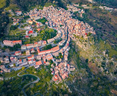 View from flying drone. Top down cotyscape of Novara di Sicilia town. Aerial spring view of Sicily, Italy, Europe. Beautiful world of Mediterranean countries. Traveling concept background.の写真素材