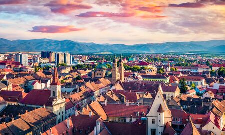 Aerial summer view of Cathedral of the Holy Trinity. Colorful morning cityscape of Sibiu town. Impressive sunrise in Transylvania, Romania, Europe. Traveling concept background.の写真素材
