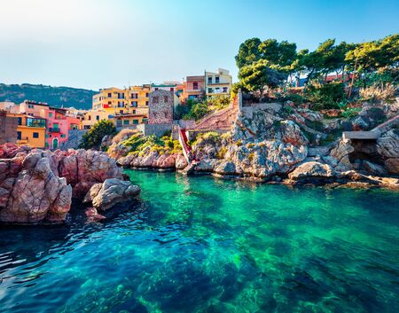 Sunny spring view of Sant' Elia village. Splendid azure water bay on Sicily, Palermo city location,...