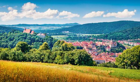 Attractive morning cityscape of Sighisoara. Magnificent summer view of medieval town of...
