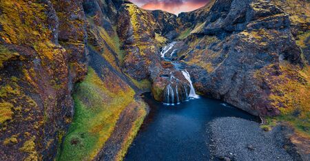 View from flying drone of Stjornarfoss waterfall. Impressive summer sunrise in Iceland, Europe. Beauty of nature concept background. Travel to Iceland.の写真素材