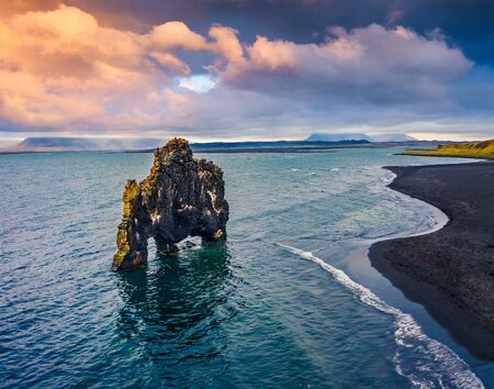View from flying drone. Beautifulsunset with huge basalt stack - Hvitserkur on background. Splendid summer scene of eastern shore of the Vatnsnes peninsula, Iceland, Europe.の写真素材