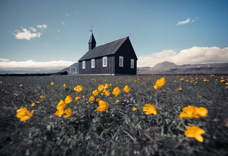 Black wooden Budakirkja church at Saefellsnes. Retro style summer view of Snafellsnes peninsula,...
