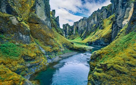 View from flying drone of Fjadrargljufur canyon and river. Green fresh scene of South east Iceland, Europe. Beauty of nature concept background.の写真素材