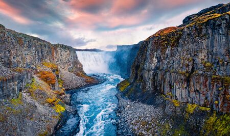 View from down of canyon of most powerful waterfall in Europe - Dettifoss. Splendid summer sunrise in Jokulsargljufur National Park, Iceland. View from flying drone.の写真素材