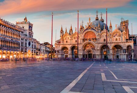 Fantastic sanset on San Marco square with Saint Mark's Basilica. Spectacular evening cityscape of Venice, Italy, Europe. Traveling concept background.の写真素材