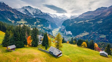 View from flying drone of Wengen village, district of Lauterbrunnen. Dramatic morning scene of Swiss Alps. Aerial autumn landscape of Switzerland countryside, Europe. Traveling concept background.の写真素材