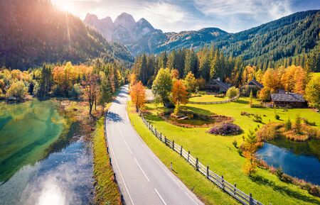 View from flying drone. Bright autumn view of Gosaubach lake. Romantic morning scene of Austrian Alps, Upper Austria, Europe. Beauty of nature concept background.の写真素材
