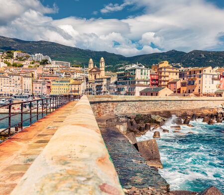 Amazing summer cityscape of Bastia port with twin-towered Church of St. Jean-Baptiste rising behind it. Marvelous morning view of Corsica island, France, Europe. Sunny Mediterranean seascape.の写真素材