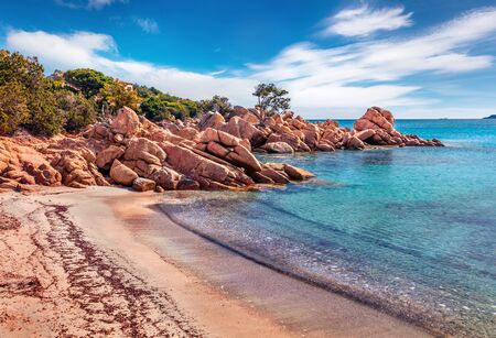 Romantic morning scene of popular touris deastination - Capriccioli beach. Wonderful summer view of public beach with sand & granite rocks nestled in a cove with Mediterranean greenery, Sardinia, Italy.の写真素材