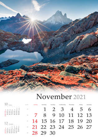 Calendar November 2021, vertical B3 size. Set of calendars with amazing landscapes. Fantastic autumn view of Lac Blanc lake and Mont Blanc, Chamonix location, Graian Alps, France, Europe.の写真素材