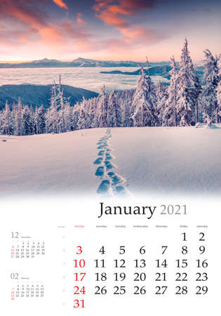 Calendar January 2021, vertical B3 size. Set of calendars with amazing landscapes. Spectacular winter view of mountain forest. Superb sunrise in Carpathian mountains, Ukraine, Europe.の写真素材