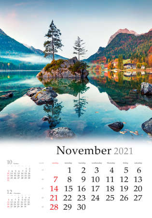 Calendar November 2021, vertical B3 size. Set of calendars with amazing landscapes. Beautiful autumn scene of Hintersee lake. Misty morning view of Bavarian Alps, Germany, Europe.の写真素材