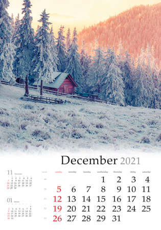 Calendar December 2021, vertical B3 size. Set of calendars with amazing landscapes. Stunning morning view of mountain village. Unbelievable winter sunset in Carpathian mountain, Ukraineの写真素材