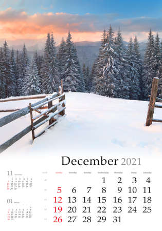 Calendar December 2021, vertical B3 size. Set of calendars with amazing landscapes. Gorgeous morning view of mountain forest. Fantastic winter sunrise in Carpathian mountains, Ukraine, Europe.の写真素材