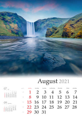 Calendar August 2021, vertical B3 size. Set of calendars with amazing landscapes. Gloomy morning view of Skogafoss Waterfall. Astonishing summer sunrise on Skoga river, Iceland, Europe.の写真素材