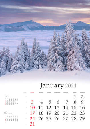 Calendar January 2021, vertical B3 size. Set of calendars with amazing landscapes. Exciting winter view of foggy valley. Captivating sunrise in Carpathian mountains, Ukraine, Europe.の写真素材