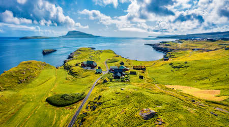 View from flying drone. Colorful morning view of outskirts of Torshavn city, capital of Faroe Islands, Denmark, Europe. Spectacular summer seascape of Atlantic Ocean. Traveling concept background.の写真素材