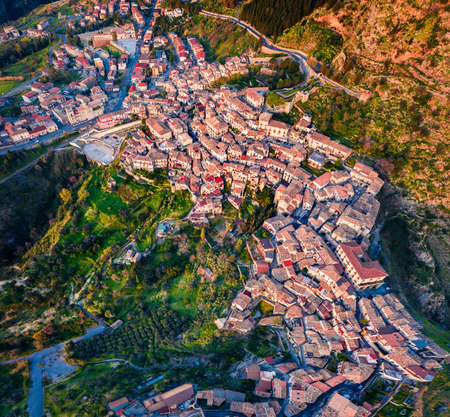 Top down view view from flying drone. Colorful morning cityscape of Stilo town. Adorable summer scene of Italy, Europe. Traveling concept background.の写真素材