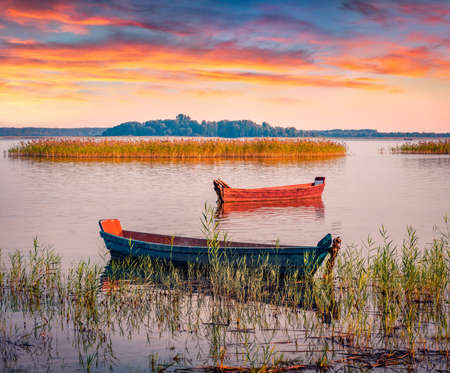 Two fifhing boats on the Svityaz lake. Spectacular sunrise on Shatsky National Park, Volyn region, Ukraine, Europe. beauty of nature concept background.の写真素材