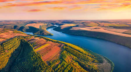 Unbelievable morning view from flying drone of canyon of Ushytsia river. Bright summer scene of Ukrainian countryside. beauty of nature concept background.の写真素材