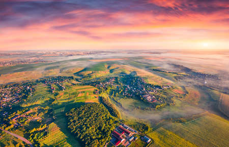 Rural landscape photography. Foggy autumn sunrise on countryside. Captivating morning view from...