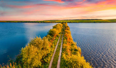 Unbelievable summer sunrise on Vertelka lake, Ternopil region. Splendid morning view from flying drone of Ukrainian countryside. Travel concept background.の写真素材