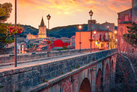 Spectacular cityscape of Novara di Sicilia town. Wonderful summer sunrise in Sicily, Italy, Europe....