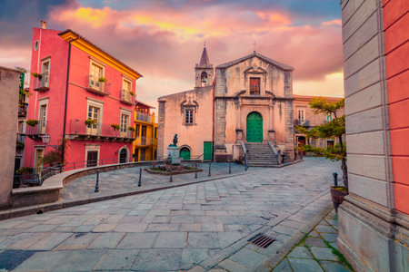 Charm of the ancient cities of Europe. Astonishing spring cityscape of Novara di Sicilia town with Chiesa di San Nicolo church. Colorful sunrise in Sicily, Italy. Travel concept background.の写真素材