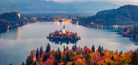aerial landscape photography. Colorful morning scene of Pilgrimage Church of the Assumption of Maria. Aerial autumn view of Bled lake, Julian Alps, Slovenia, Europe. Travel concept background.の写真素材