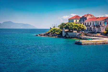Charm of the ancient cities of Europe. Exciting summer view of Fiskardo port. Sunny morning seascape of Ionian Sea. Bright outdoor scene of Kefalonia island, Greece, Europe.の写真素材