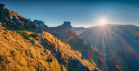 landscape photography. View from flying drone of veird shapes stone on the Vuhatiy Kamin' mountain range. Picturesque summer sunrise on Carpathian mountains, Ukraine, Europe.の写真素材