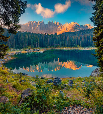 beautiful summer scenery. Splendid morning view of Carezza (Karersee) lake. Attractive summer scene of Dolomiti Alps, Province of Bolzano, South Tyrol, Italy, Europe.の写真素材