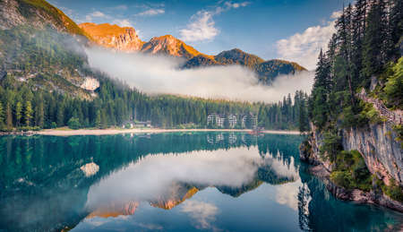 beautiful summer scenery. Foggy morning view of Braies (Pragser Wildsee) lake. Splendid summer scene of Fanes-Sennes-Braies national park, Dolomiti Alps, South Tyrol, Italy, Europe.の写真素材