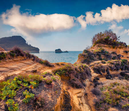Amazing spring view of famous Channel Of Love (Canal d'Amour) beach. Bright morning seascape of Ionian Sea. Impressive outdoor scene of Corfu Island, Greece, Europe.の写真素材