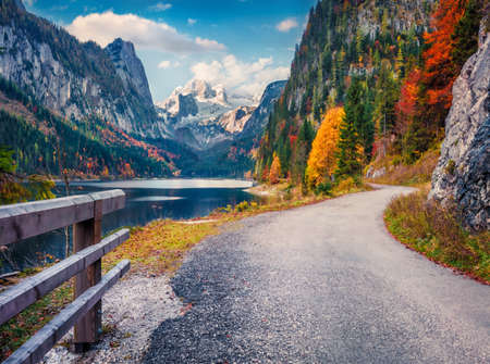 beautiful autumn scenery. Spectacular morning scene of Vorderer ( Gosausee ) lake with Dachstein glacieron background. Picturesque morning view of the Austrian Alps, Upper Austria, Europe.の写真素材
