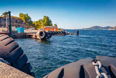 landscape photography. Picturesque summer view of small Norwegian farry port. Wonderful morning seascape of North sea, Norway, Europe. Travel concept background.のeditorial素材