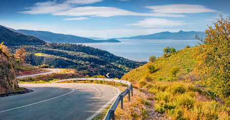 Typical Albanian landscape on the Adriatic shore with empty asphalt road. Bright spring morning in Albania, Europe. Travel concept background.の写真素材