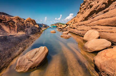 Rocky coast of Dalan and Voge hiking area. Spectacular summer seascape of the Adriatic sea. Incredible morning scene of Albania, Europe. Beauty of nature concept background.の写真素材