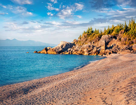Attractive spring view of empty Livadhi beach, Himare village location. Calm morning scene of Albania, Europe. Incredible seascape of the Adriatic sea. Beauty of nature concept background.の写真素材