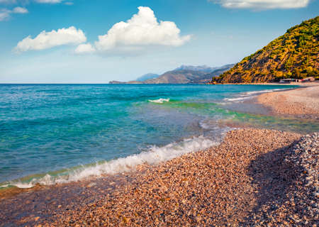 Colorful spring view of Buneci Beach with small creek flowing in to the sea. Splendid morning seascape of the Adriatic Sea. Attractive spring scene of Albania, Europe. Travel concept background.の写真素材